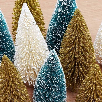 gold, white, and green bottle brush trees in different sizes
