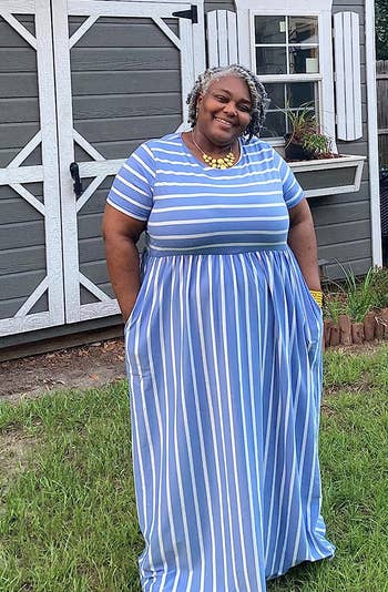 reviewer in light blue and white striped maxi dress
