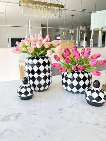 two shades of fake tulips in their own vases