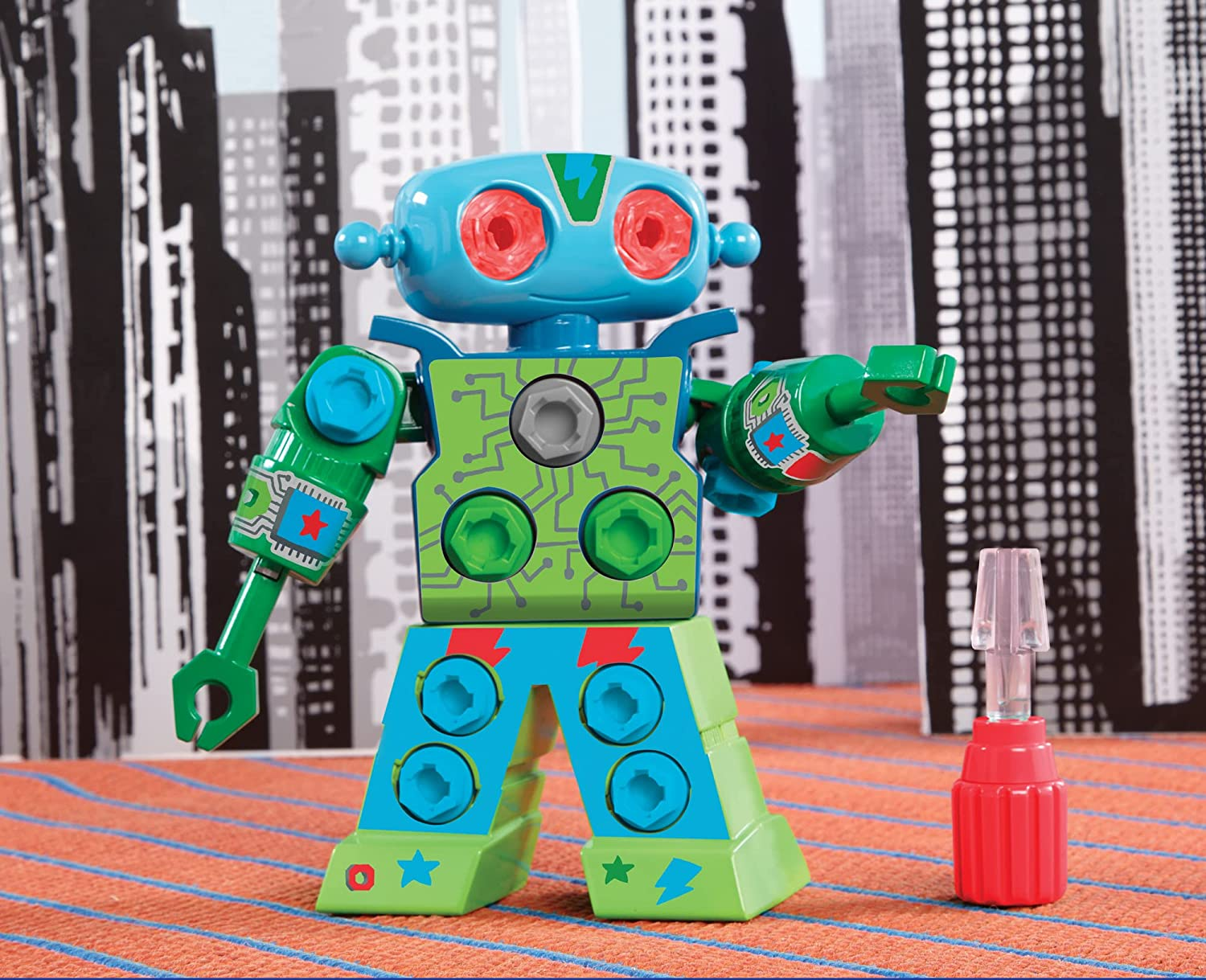 A green and blue  plastic robot toy with red eyes