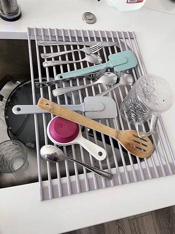 reviewer photo of utensils drying over over-sink drying rack