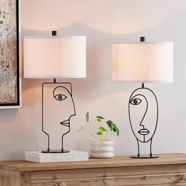 two abstract table lamps with white lamp shades