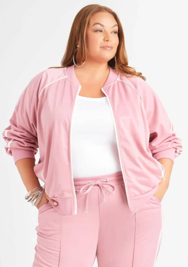 model wearing stretchy track jacket in pink
