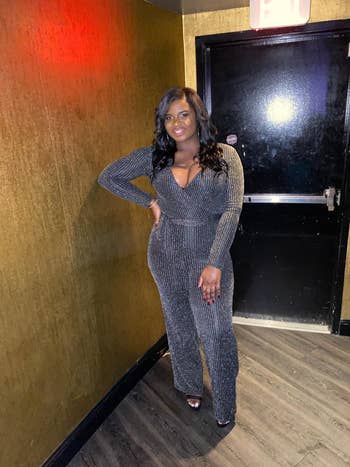 reviewer wearing the jumpsuit in grey