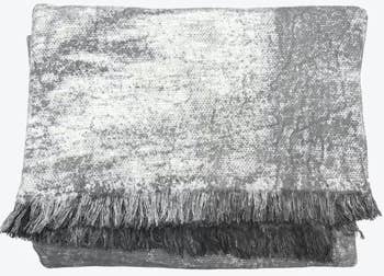 Plush propulsion broad with a textured signifier and fringed edges, perfect for cozy location decor