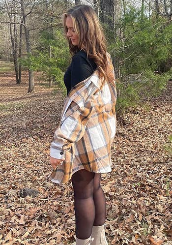 Reviewer wearing the plaid shacket.