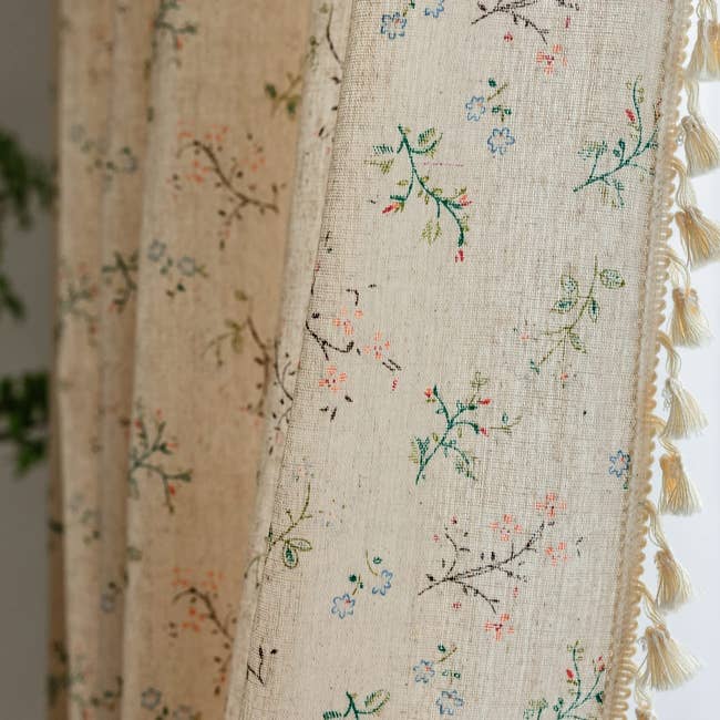 floral curtains with tassels on  the edge