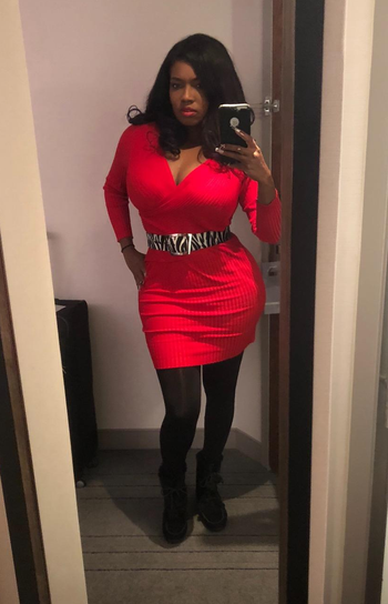 reviewer mirror selfie wearing the dress in red