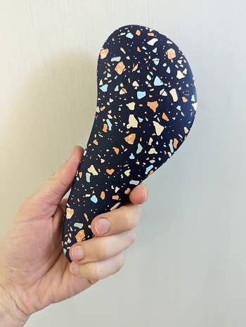 reviewer with the terrazzo brush