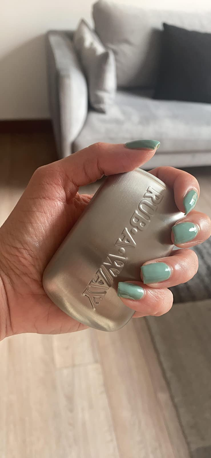 a reviewer holding the odor absorber