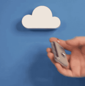 gif of someone sticking keys to the magnetic cloud key holder, which is mounted onto a blue wall
