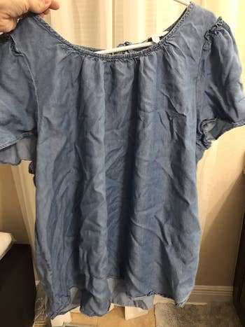reviewer before image of a wrinkled denim top