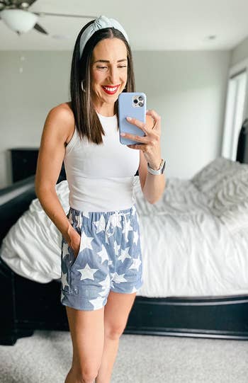 A reviewer wearing the striped stars shorts