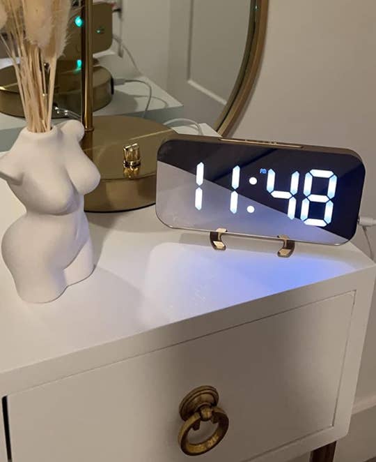 the alarm clock on a reviewers nightstand 