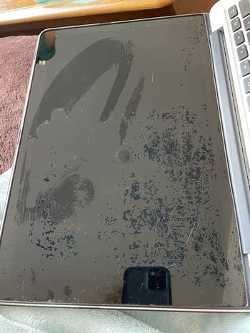 reviewer photo of a laptop screen that looks streaky and stained