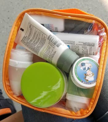 reviewers orange bag with products inside