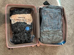 BuzzFeed writer's suitcase with multiple vacuum sealed bags and still extra room
