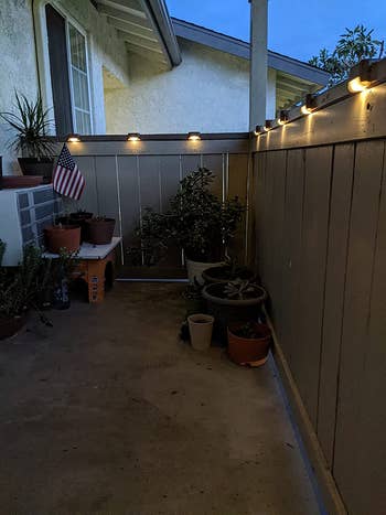 a reviewer's outdoor patio with clip on lighting