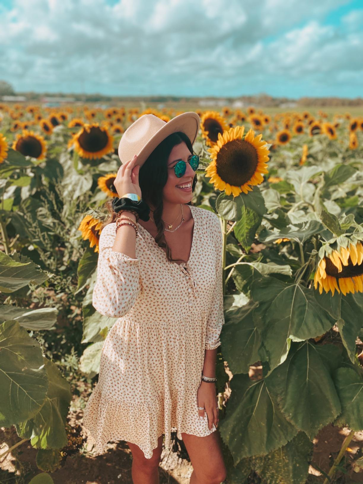 reviewer wearing the hat in light brown