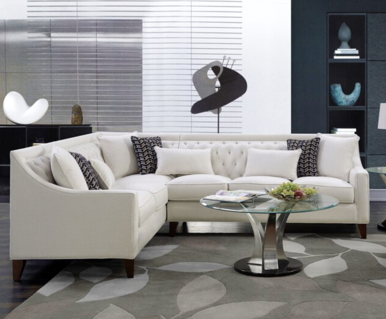 cream colored- sectional couch in a living room