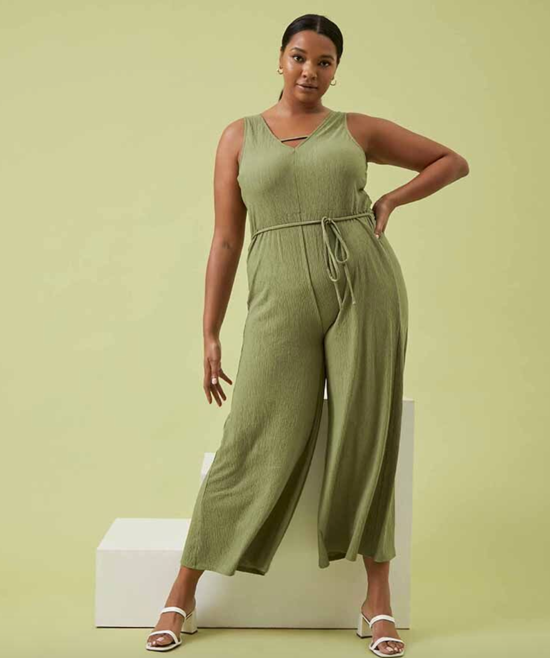 model wearing green jumpsuit