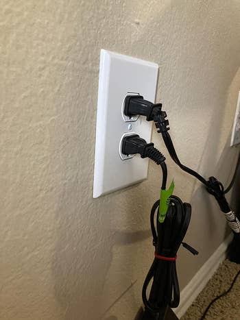 outlet with two black cords plugged in