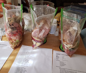 Reviewer using the bags to prop up bags to fill with frozen meals for the week