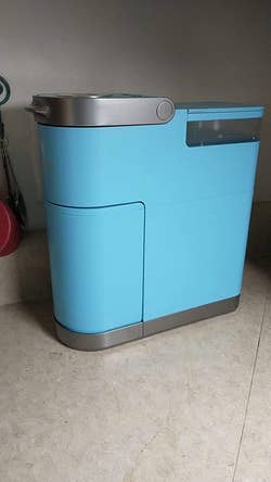a reviewer's bright blue Keurig with the storage section tucked away 
