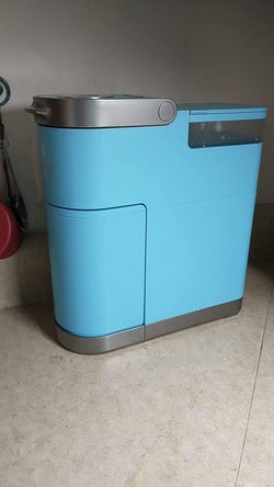 a reviewer's bright blue Keurig with the storage section tucked away