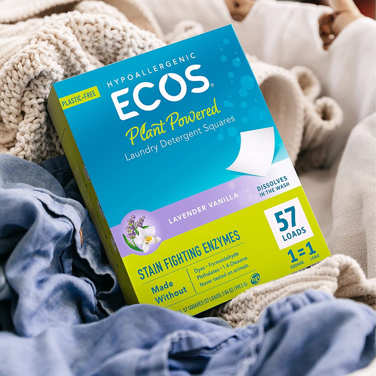 box of ECOS laundry detergent squares on a pile of clean laundry