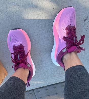 reviewer wearing the blistery pinkish shoes