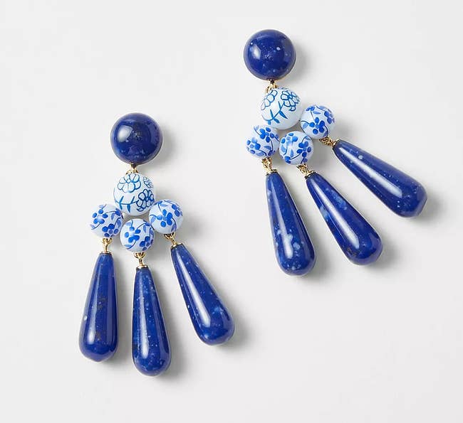 earrings with blue stones and white beads painted with blue flowers