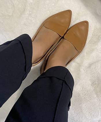 reviewer wearing the tan loafers