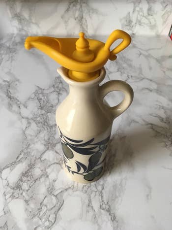 reviewer's yellow genie lamp stopper in a bottle