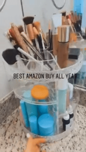 gif of reviewer turning the makeup organizer with text: best amazon buy all year