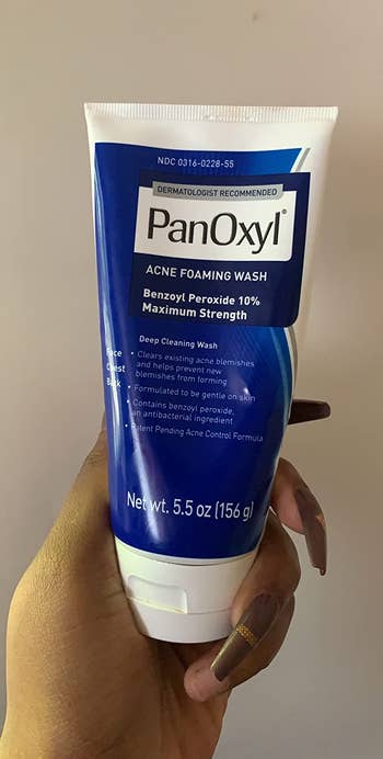 Reviewer holding their PanOxyl wash