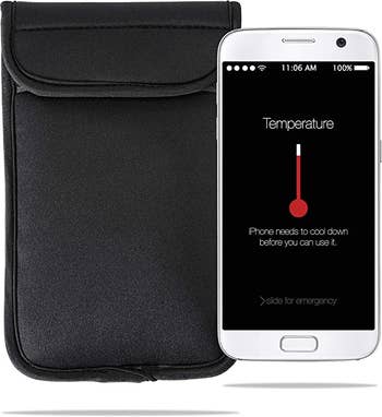 The black insulated phone case next to an iPhone showing a temperature warning that reads 
