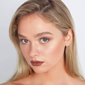 blonde model wearing the bronzer with brown-ish lipstick