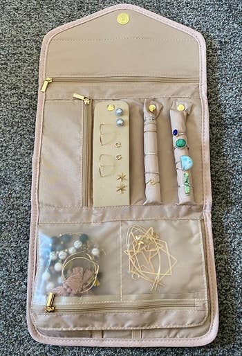 Reviewer photo of the jewelry case with various pieces inside