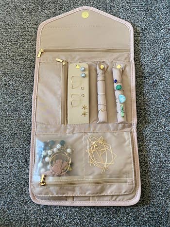 Reviewer's jewelry case with various pieces inside