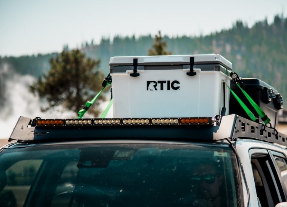 the white cooler on top of a car