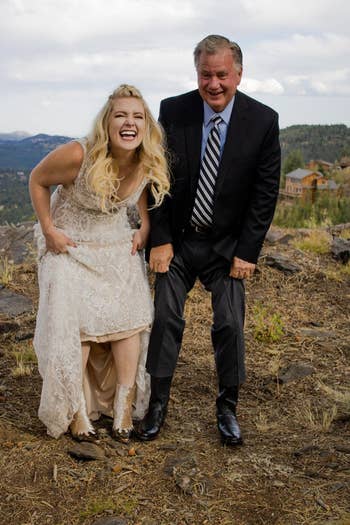 Woman successful a lace formal and antheral successful a suit laughter unneurotic outdoors, apt astatine a casual outdoor lawsuit oregon gathering