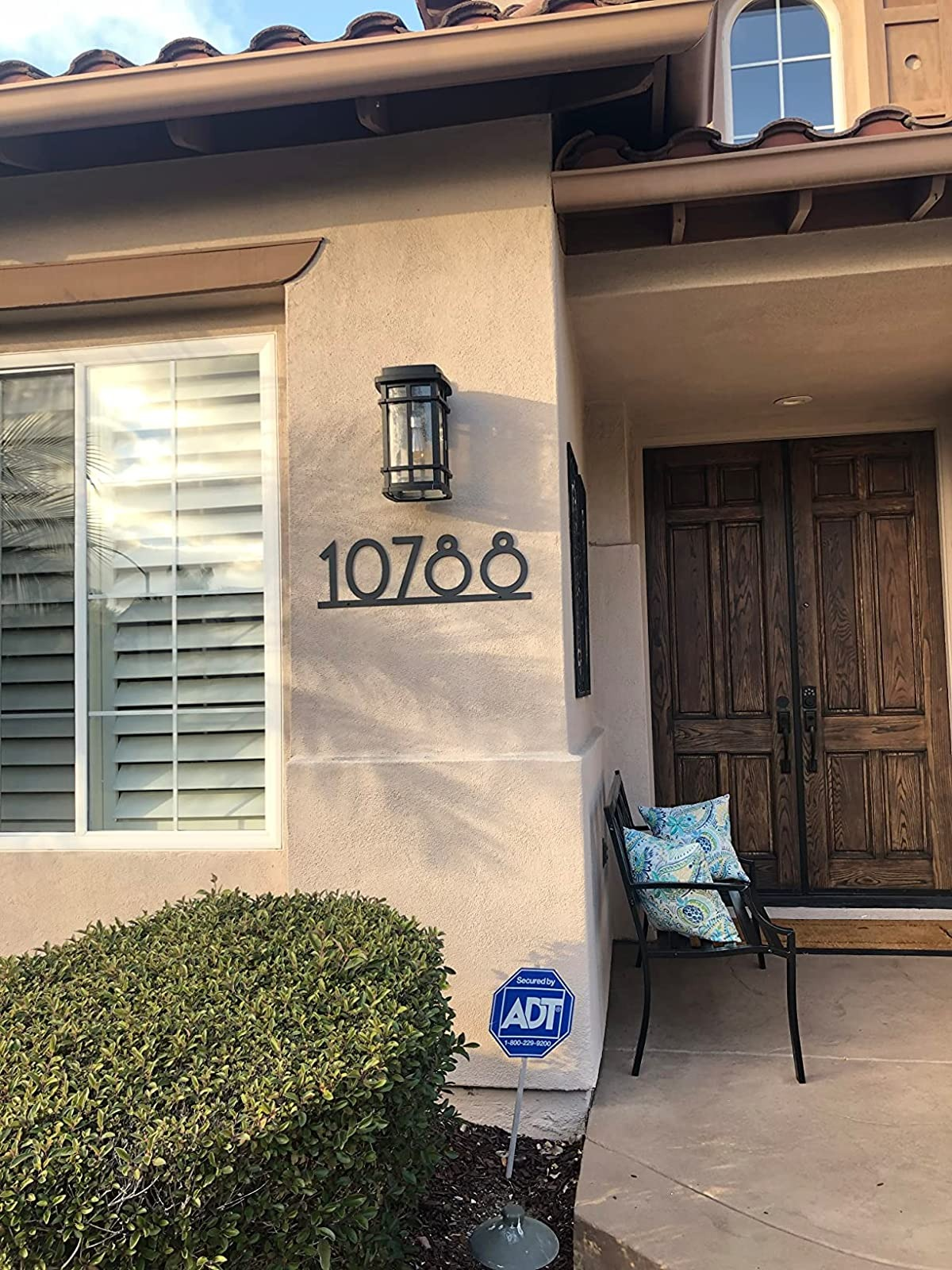 reviewer image of the number 10788 in metal pieces on the outer wall of a house