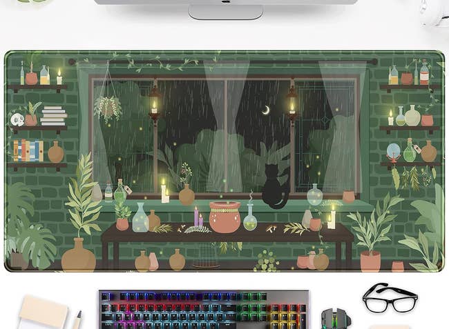 the large desk mat featuring a rainy scene