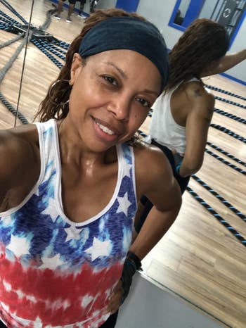 reviewer wearing the navy headband for a workout