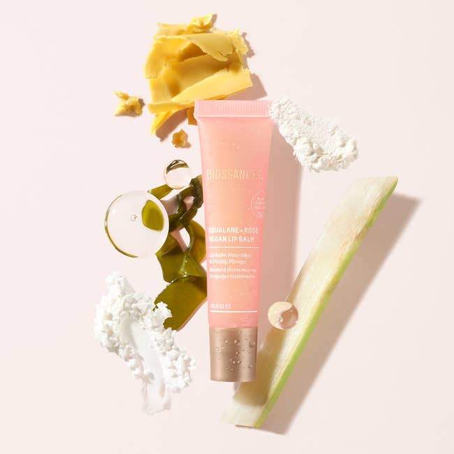 Pink and gold tube of Biossance Rose Vegan Lip Balm 