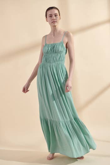 front view of a model in the mint maxi dress
