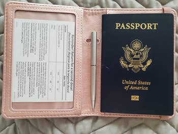 reviewer photo of vaccine card and passport in holder