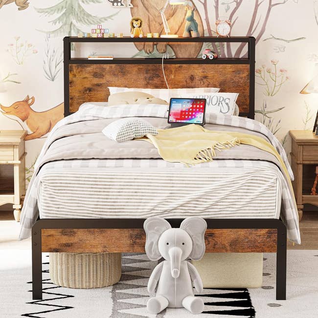industrial-style brown twin bed frame with striped gray bedding