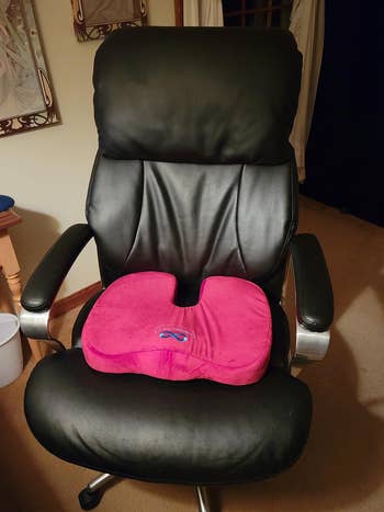 Reviewer's red seat cushion on desk chair